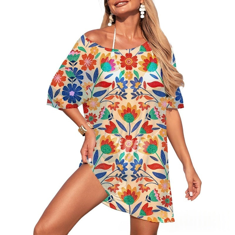 A woman wearing a premium breathable black beachwear mesh swim cover-up over a swimsuit