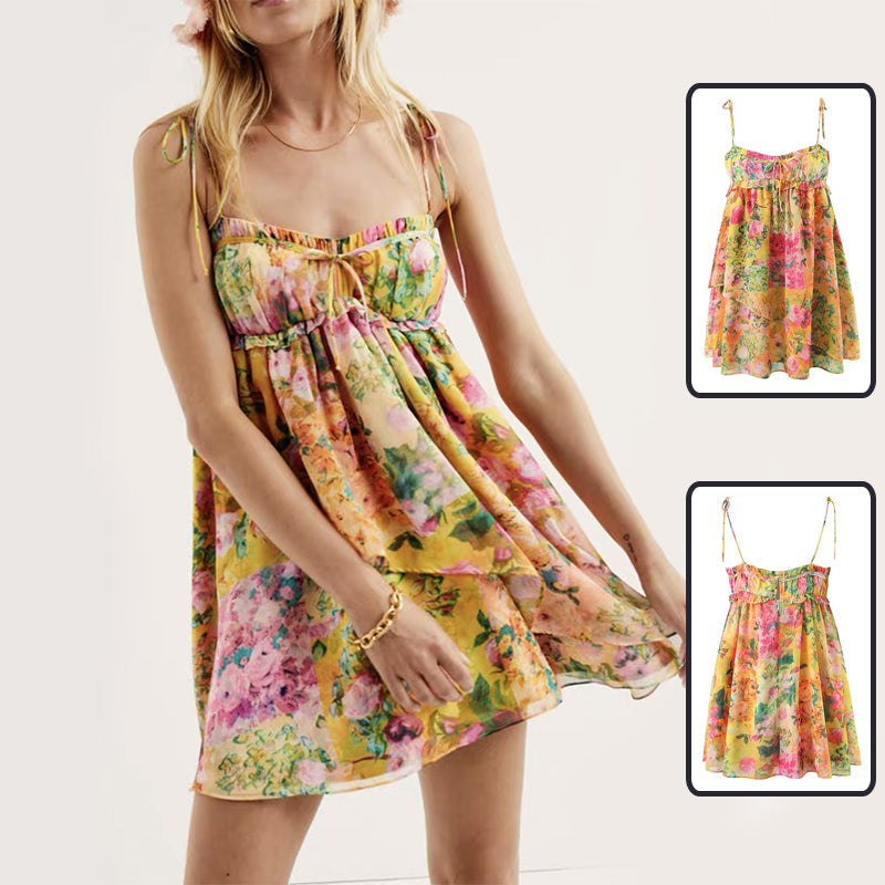 Front and back view of a model wearing a breezy yellow ruffled Y2K floral suspender mini dress, styled as a hot day vacation outfit.