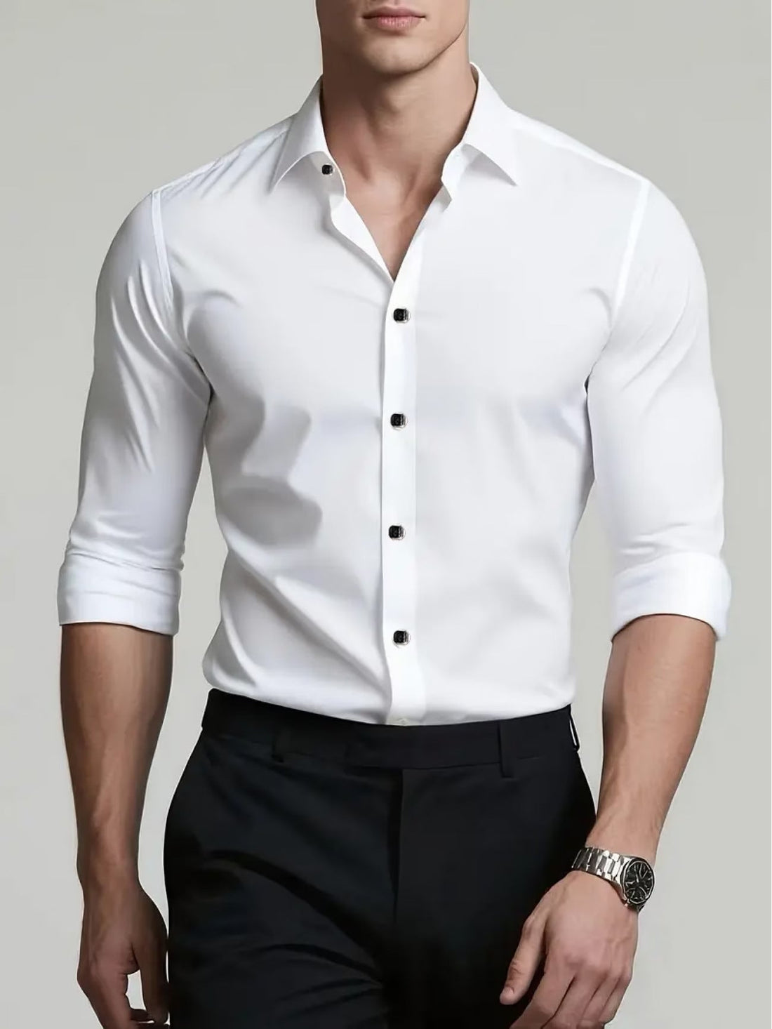 A man wearing a tailored black men's business casual long sleeve shirt with a premium pigment dyed finish.